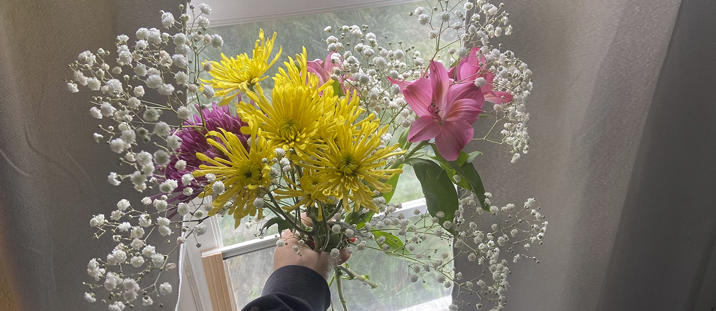 aligned flowers in hand